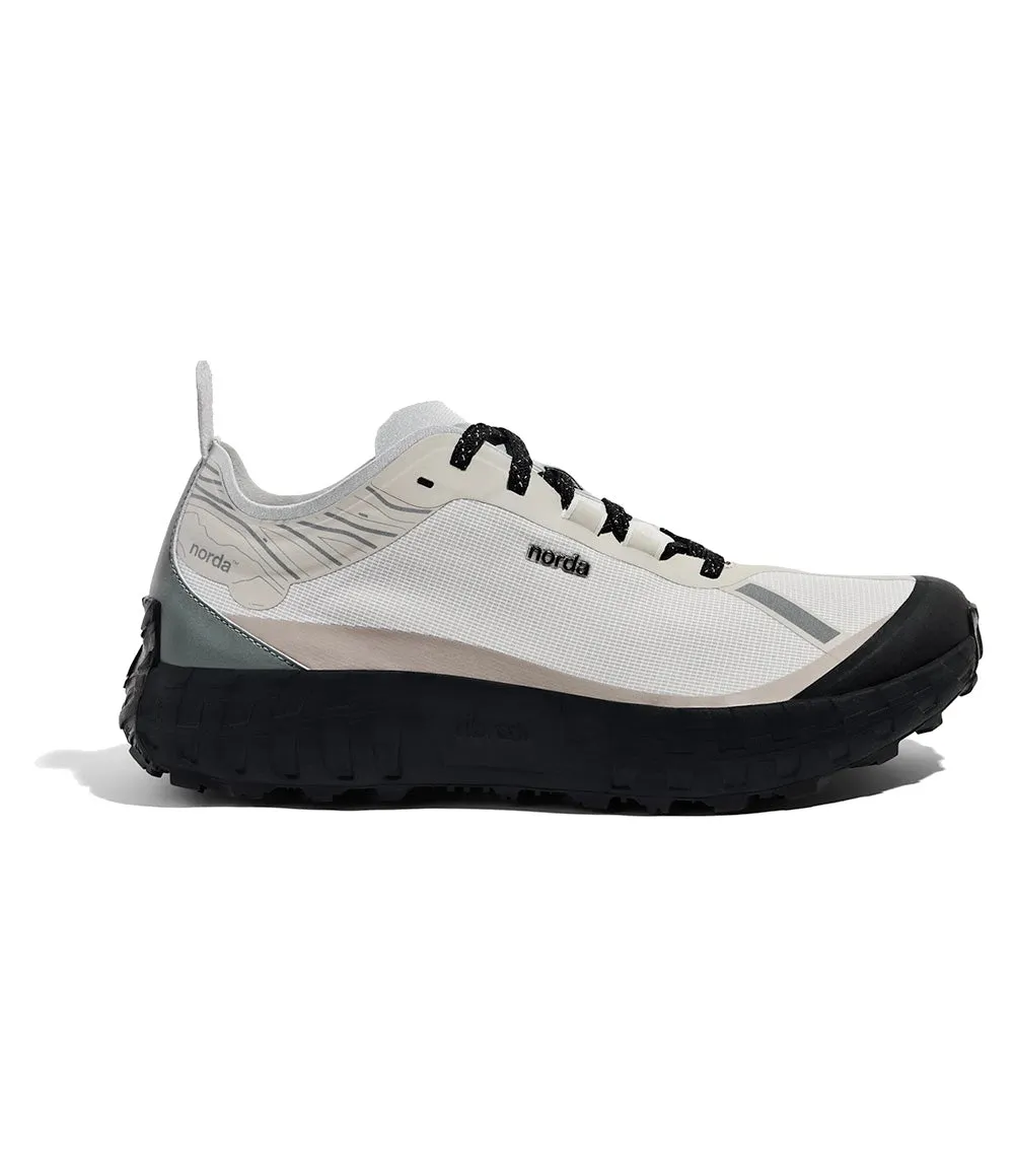 M 001 black running shoes running in a snow - covered area shoes